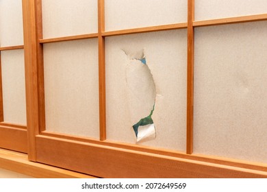 Japanese shoji with broken white paper - Shutterstock ID 2072649569