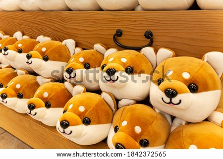 A Japanese shop with a lot of Shiba Inu stuffed animals