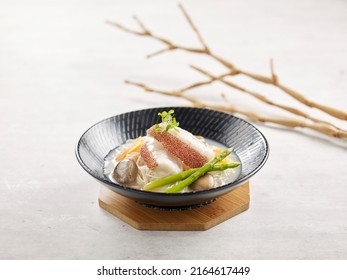 Japanese Somen With Grouper Fillet In Fish Soup Served In A Dish Side View On Grey Background