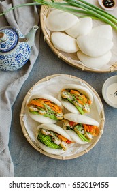 Japanese style steamed buns for breakfast or afternoon tea snack / Vegetarian Guo Bao / Wrapped with seaweed,egg,carrot and avocado slices,cherry tomatoes,scallions,sesame seeds,tahini and soy sauce