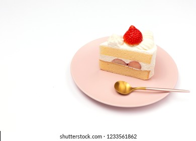 Japanese Style Strawberry Shortcake On The Pink Plate On White Background. Side View, Copy Space For Your Text.