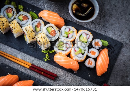 japanese sushi food. Maki ands rolls with tuna, salmon, shrimp, crab and avocado. Top view of assorted sushi. Rainbow sushi roll, uramaki, hosomaki and nigiri.  Stockfoto © 