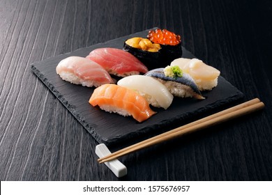 Japanese sushi set on black slate - Powered by Shutterstock