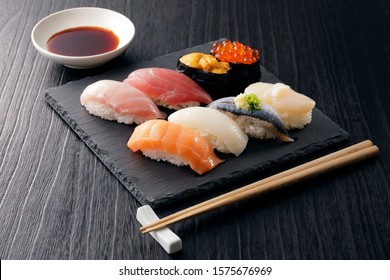 Japanese sushi set on black slate - Powered by Shutterstock