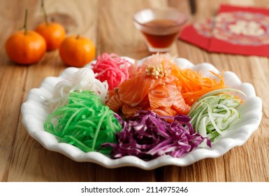 Japanese Sushi Yu Sheng. Chinese New Year Salmon Prosperity Toss On Wooden Background