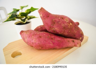 japanese sweet potatoes on wooden background