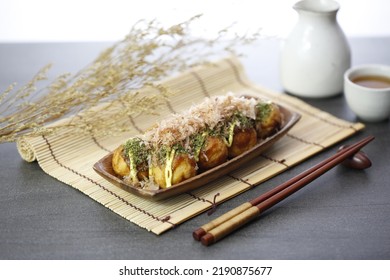 Japanese Takoyaki With Bonito Flakes And Nori Powder Snack On Wood Wooden Plate