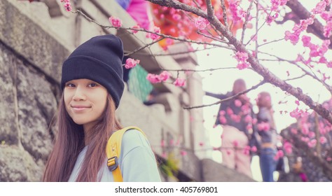 Japanese teenager with blossom flower vintage background