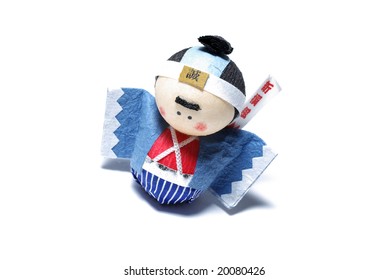 Japanese toy with asian symbols isolated on white background.