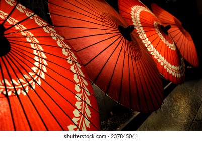 Japanese traditional red umbrellas with with floral motives