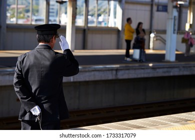 Japanese Train Conductor At Station 