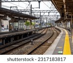 Japanese train station. Serene and still, the empty Japanese train station exudes a tranquil ambiance, with platforms awaiting the rush of passengers and echoes of past journeys lingering in the air.