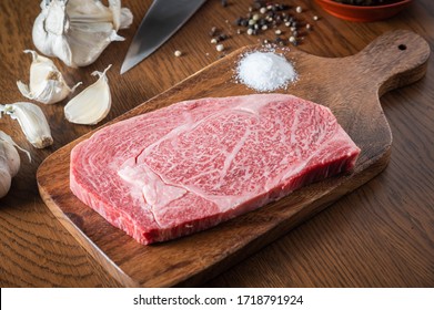japanese wagyu ribeye beef on wooden cutting board