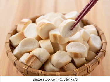 Japanese Wheat Gluten In A Colander Set Against A Wooden Background