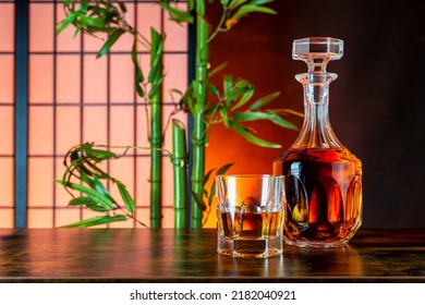 Japanese Whisky With Glass And Carafe In An Asian Ambiente