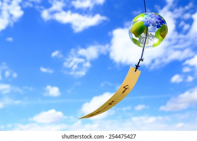 Japanese Wind Chime Against Blue Sky