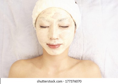 Japanese Woman Applies A Face Pack