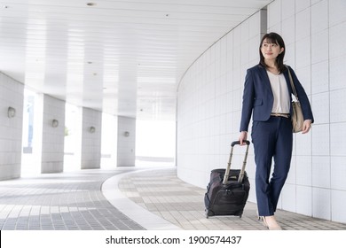 Japanese woman in a dark blue suit