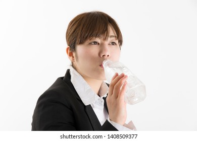 Japanese Woman Drinking Bottled Water