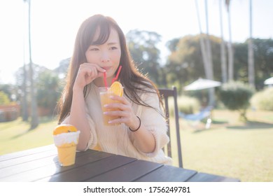 Japanese Woman Drinking Tropical Juice