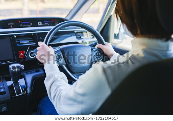 Japanese woman driving car\
safety