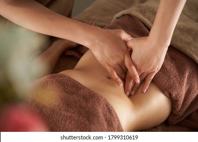 Japanese woman getting a belly massage at a beauty salon