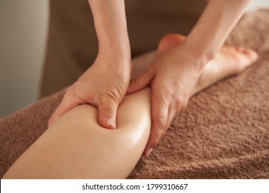 Japanese woman getting a foot massage at an aesthetic salon - Powered by Shutterstock