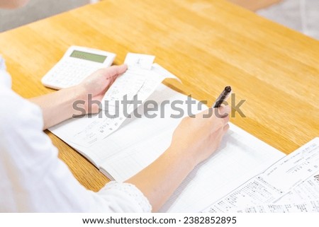 Japanese woman keeping household account book
