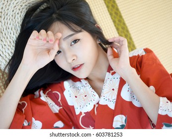 Japanese Woman In Red Flower Washitsu