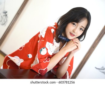 Japanese Woman In Red Flower Washitsu