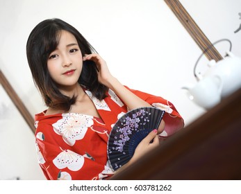 Japanese Woman In Red Flower Washitsu