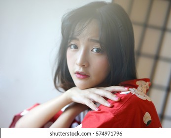 Japanese Woman In Red Washitsu Tatami Room