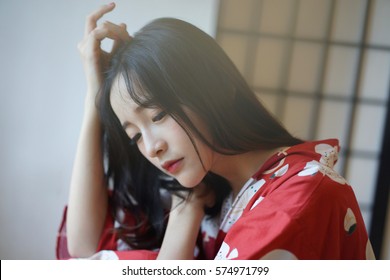 Japanese Woman In Red Washitsu Tatami Room