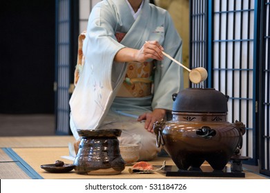 a japanese woman shows the tea ceremony during a public demonstration
