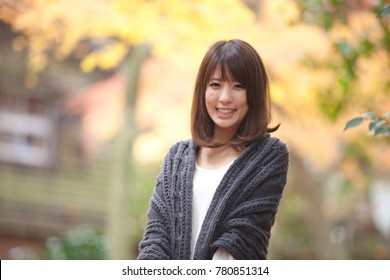 Japanese woman standing in the park