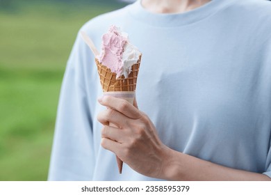 Japanese woman with  tasty gelato - Shutterstock ID 2358595379