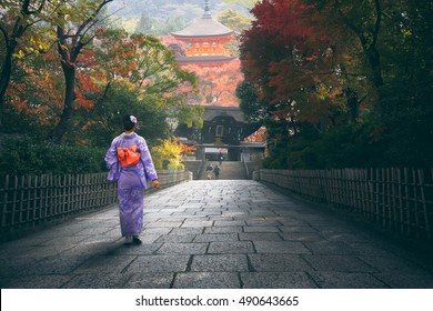 Japanese Woman Walking To Red Pagoda, Japan