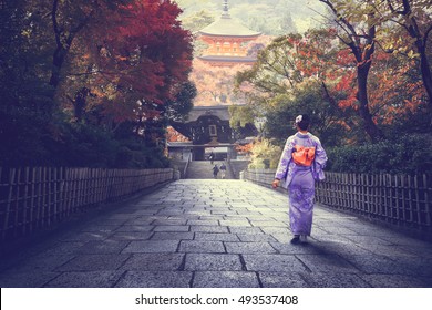 Japanese Woman Walking To Red Pagoda, Japan