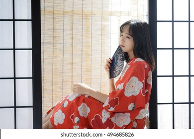 Japanese Woman In Washitsu Tatami Room