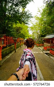 Japanese woman wearing kimono holding her lover's hand and walking trhough the japanese shrine
Japanese Test Translate as "Shrine of Kyoto"