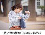 A Japanese woman who is in a hurry to forget something and is likely to be late