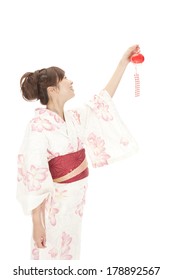 Japanese Woman In Yukata To Attempt To Install A Wind Chime