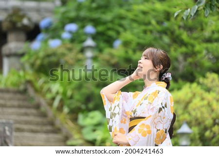 Japanese woman in yukata walking in a tourist spot