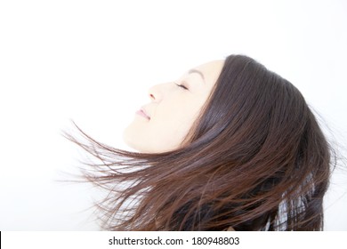 Japanese Woman's Hair Blown Away By The Wind