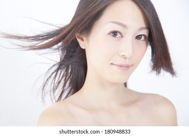 Japanese Woman's Hair Blown Away By The Wind