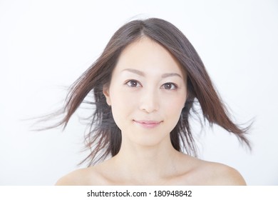 Japanese Woman's Hair Blown Away By The Wind