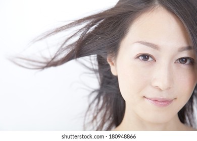 Japanese Woman's Hair Blown Away By The Wind