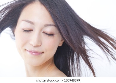 Japanese Woman's Hair Blown Away By The Wind