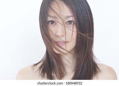 Japanese Woman's Hair Blown Away By The Wind