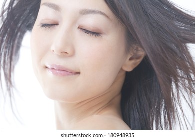 Japanese Woman's Hair Blown Away By The Wind